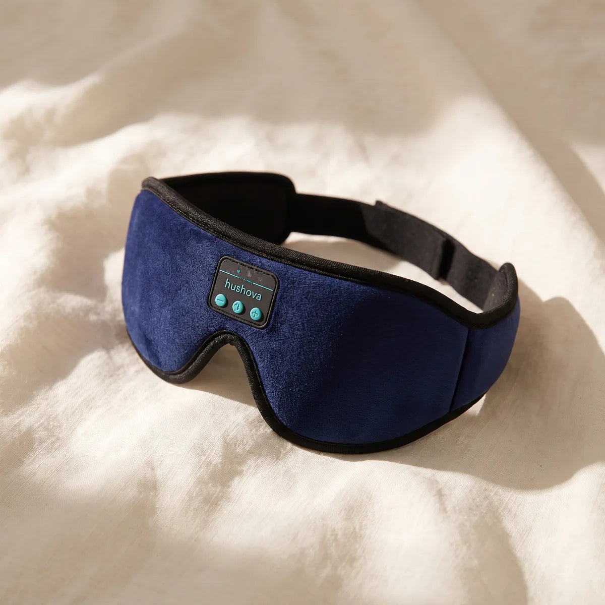 Hushova navy 3D Bluetooth sleep mask on linen