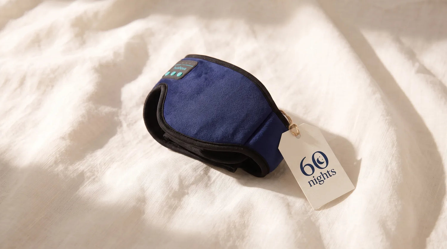 Hushova mask folded on clean linen next to a 60-night guarantee tag